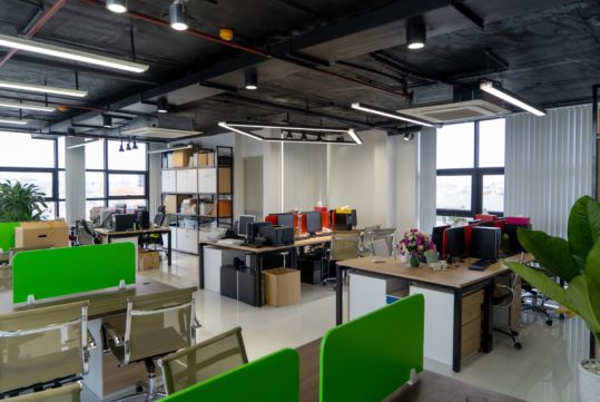 Open space office interior. Stylish creative work environment. Loft style office concept